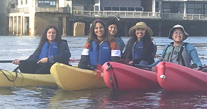 kayakers in a row