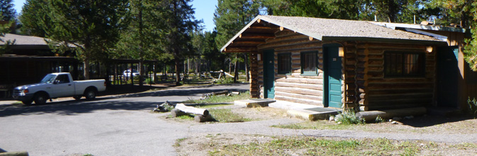 cabin next to large parking lot