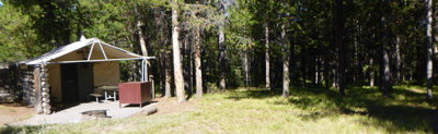 tent cabin patio facing towards forest