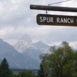 sign says Spur Ranch Cabins