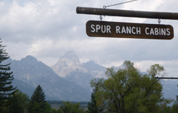 sign says Spur Ranch Cabins