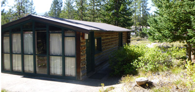 cabin with a full wall of windows