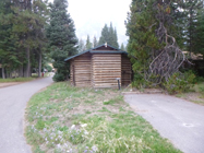 backside of cabin and two driveways