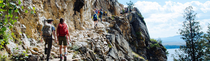 hikers on narrow trail