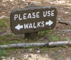 sign says please use walks