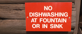 sign says no dishwashing at fountain or sink.