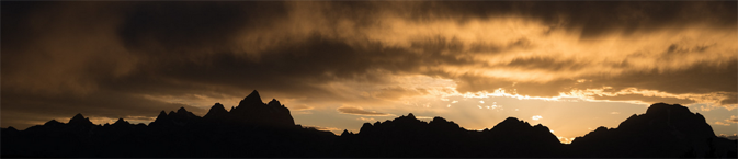 mountains and gold colored clouds