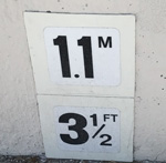sign says 1.1 meters 3 and one half feet