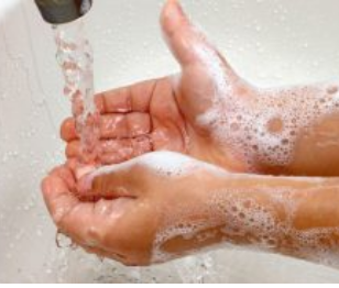 water running on soapy hands