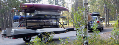 trailer with kayaks, canoe and storage pods