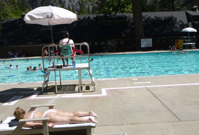 lifeguard sitting in lifeguard stand