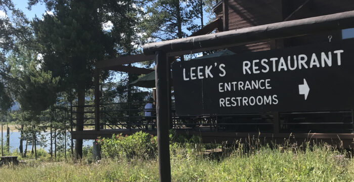 restuarant sign and deck behind