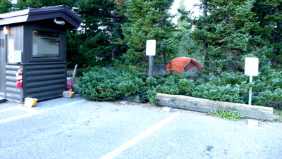 parking spaces with tent behind