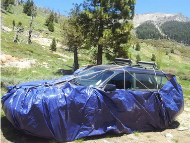 car wrapped in a tarp