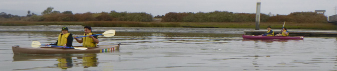 kayaks underway from dock