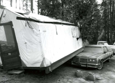 tent partially on top of car