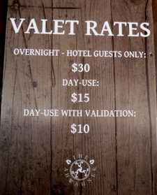 sign says valet rates overnight hotel guests only $30, day-use $15, day-use with validation$10
