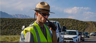 man talking on hand held radio