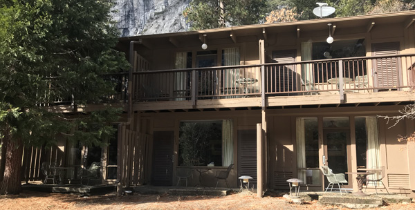 row of balconies and patios on one side of builidng