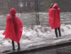 2 people wearing rain ponchos