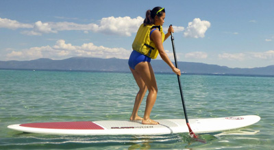 woman paddling a stand up paddleboard