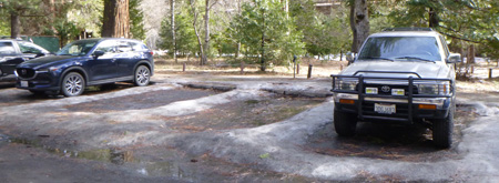 parking lot spaces with ice at their edges