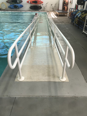 ramp going down into pool water