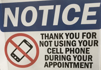 sign says thank you for not using your cell phone during your appointment