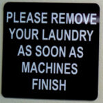 sign says please remove your laundry as soon as machine finishes