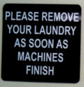 sign says please remove your laundry as soon as machine finishes