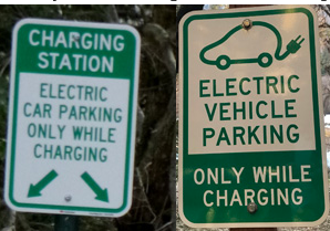 two signs that say electric vehicle parking only while charging