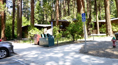 parking lot on foreground, buildings at back