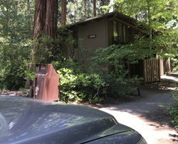 car in foreground, building in back