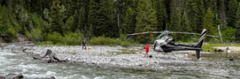 helicopter at edge of lake