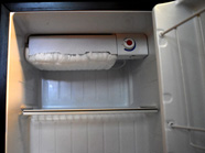 fully iced fridge freezer compartment
