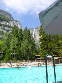 swimming pool with waterfall far in background