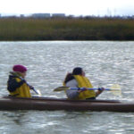 2 women in a kayak