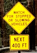 sign says watch for stopped or slowing vehicles next 400 feet