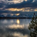 sunset reflection on mountain and lake