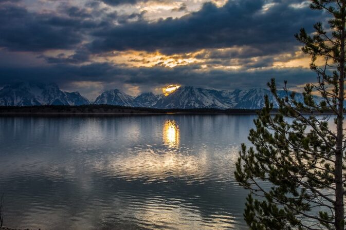sunset reflection on mountain and lake