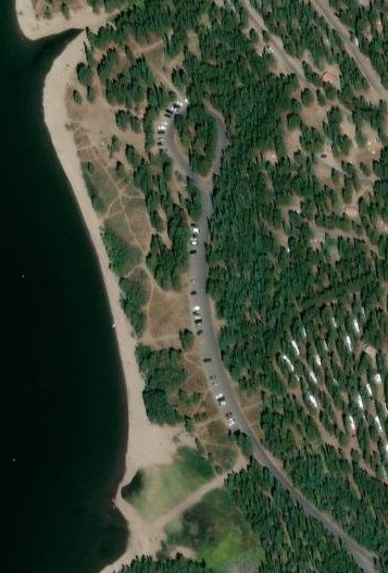 aerial photo of road and long beach