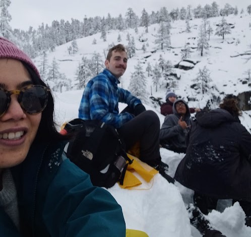 group sitting in snow