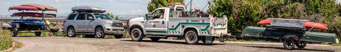 two trailers and tow vehicles