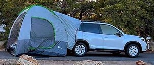 car with a tent protruding from back door