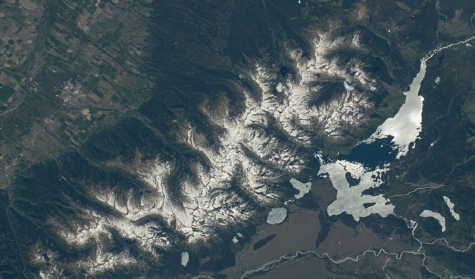snow covered mountain range from above