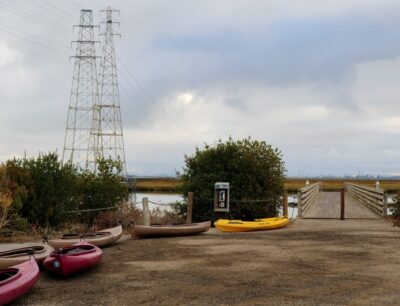 kayaks lined up near a dock entrance