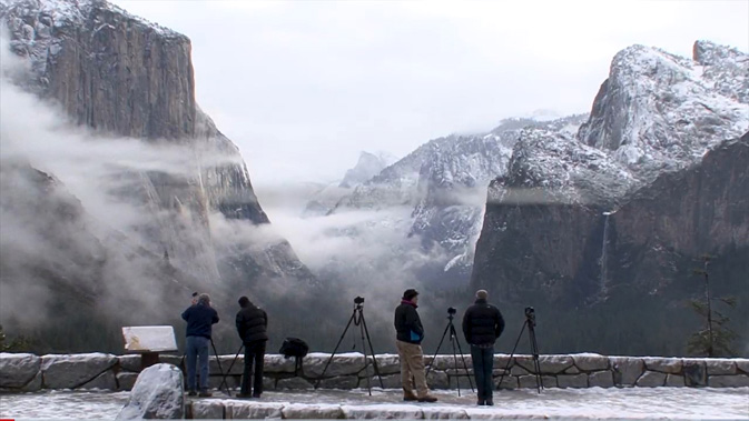 photographers and tripods over looking yosemite valley