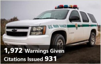 photo of park ranger vehicle with the words 931 citations given