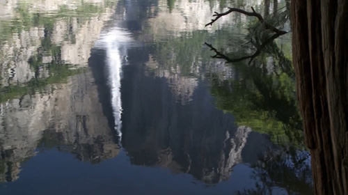 waterfall reflected in still water