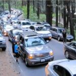 lines of stopped cars on road and sides of road